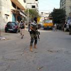 كتائب شهداء الأقصى تنظم عرض عسكري غرب غزة