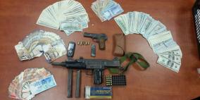 بالصور: الاحتلال يصادر ذخيرة وأسلحة و200 ألف شيقل في بيرنبالا