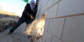 نشطاء المقاومة الشعبية يهدمون مقطعا من جدار الفصل العنصري قرب بيرنبالا