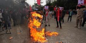 وزير العدل: حرق صور الرئيس سلوك هابط يجرمه القانون