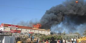 بالصور: احتراق في مخازن شركة كوكاكولا بالخليل