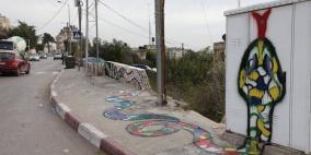 "لما الحيطان بتحكي" ..12 جدارية ترسم على جدران الضفة